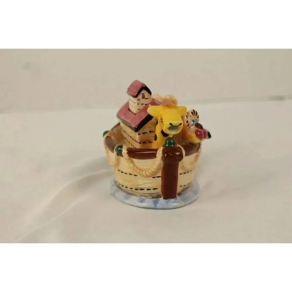 vintage animals in the boat tea pot